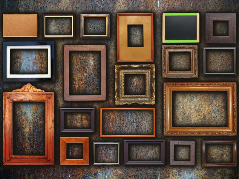 Picture frames on abstract rusty wall